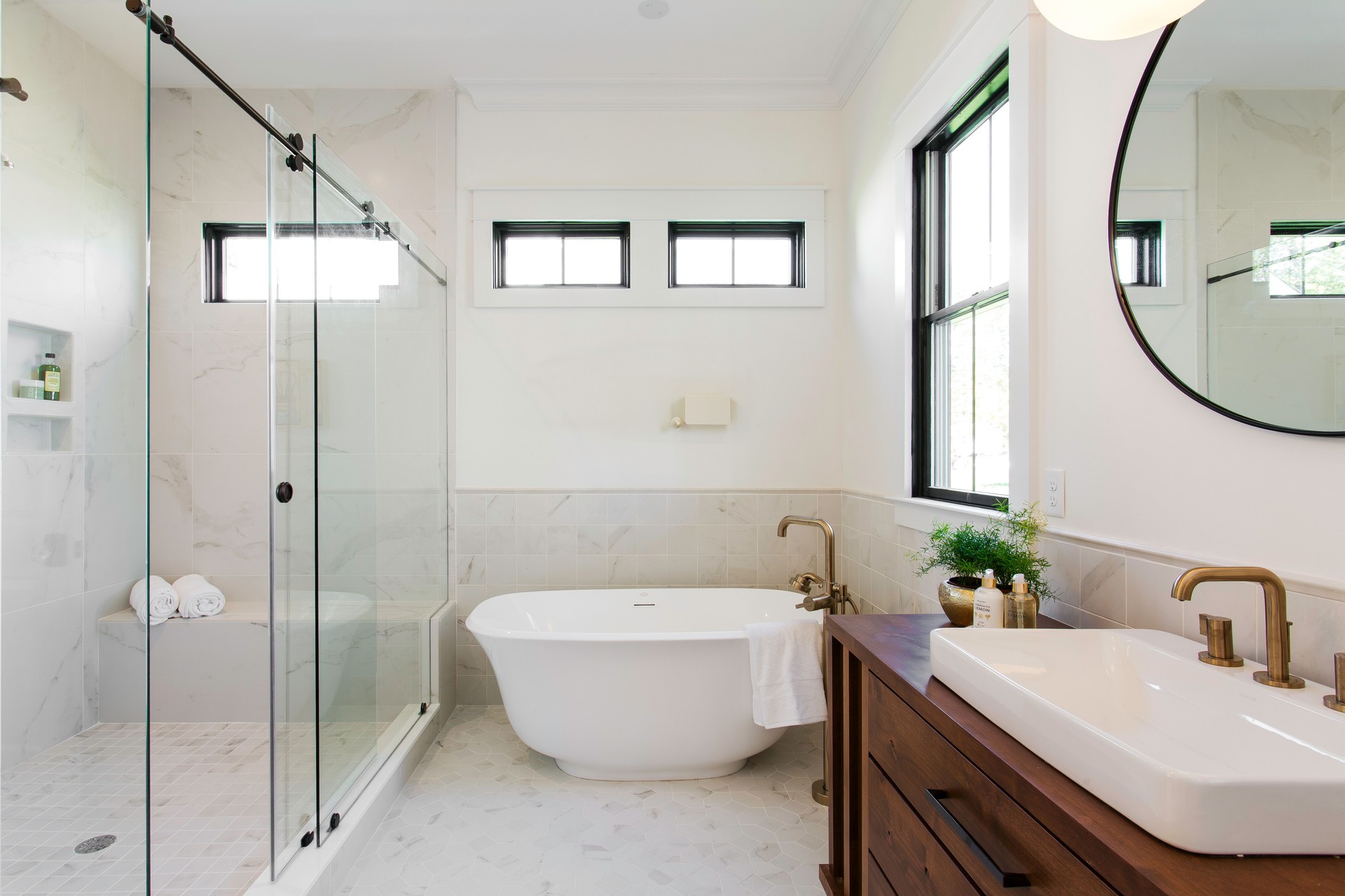 Elegant Bathroom With Bathtub And Glass Shower Door